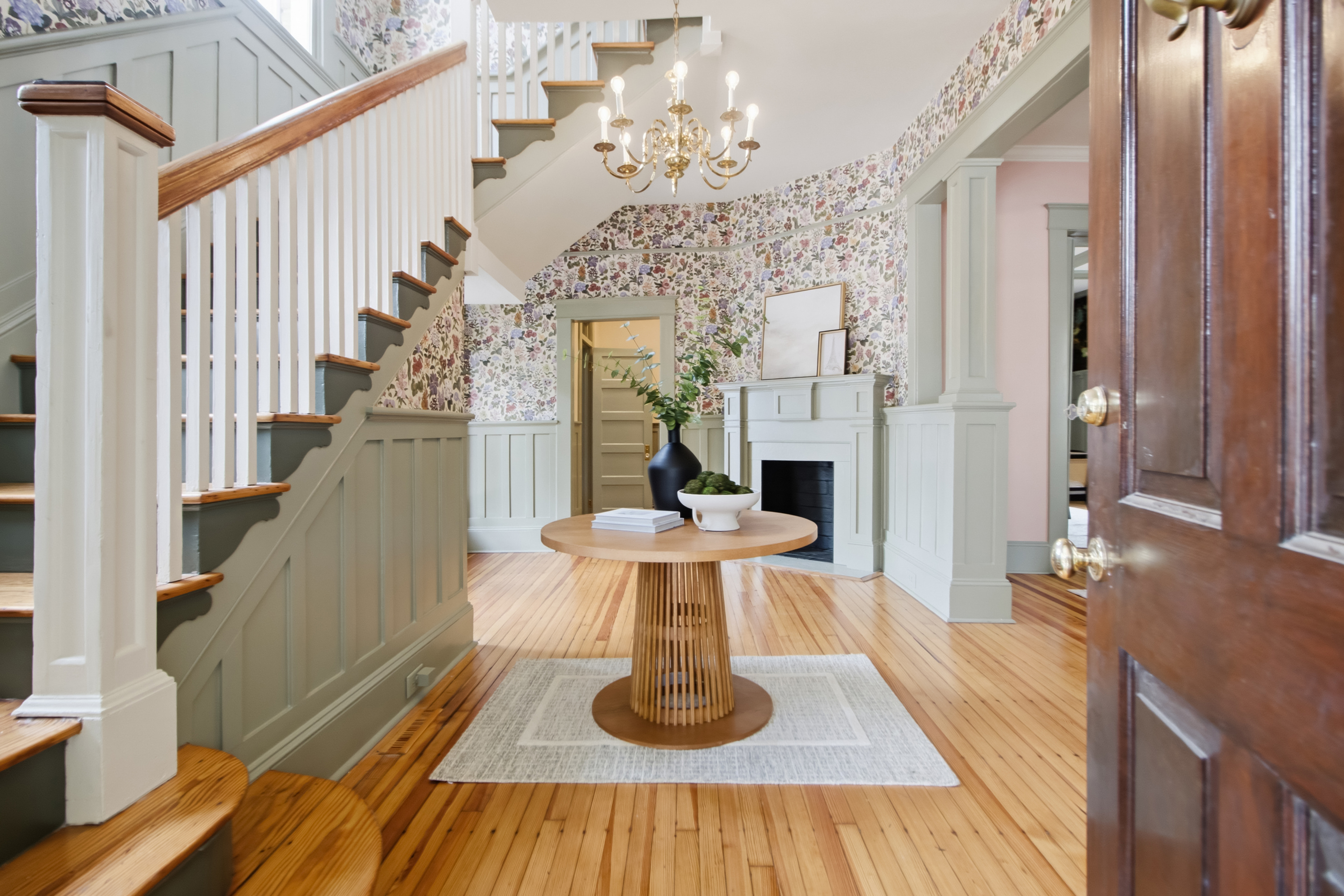 Foyer, boxed newel staircase, and original millwork at 173 Tradd Street