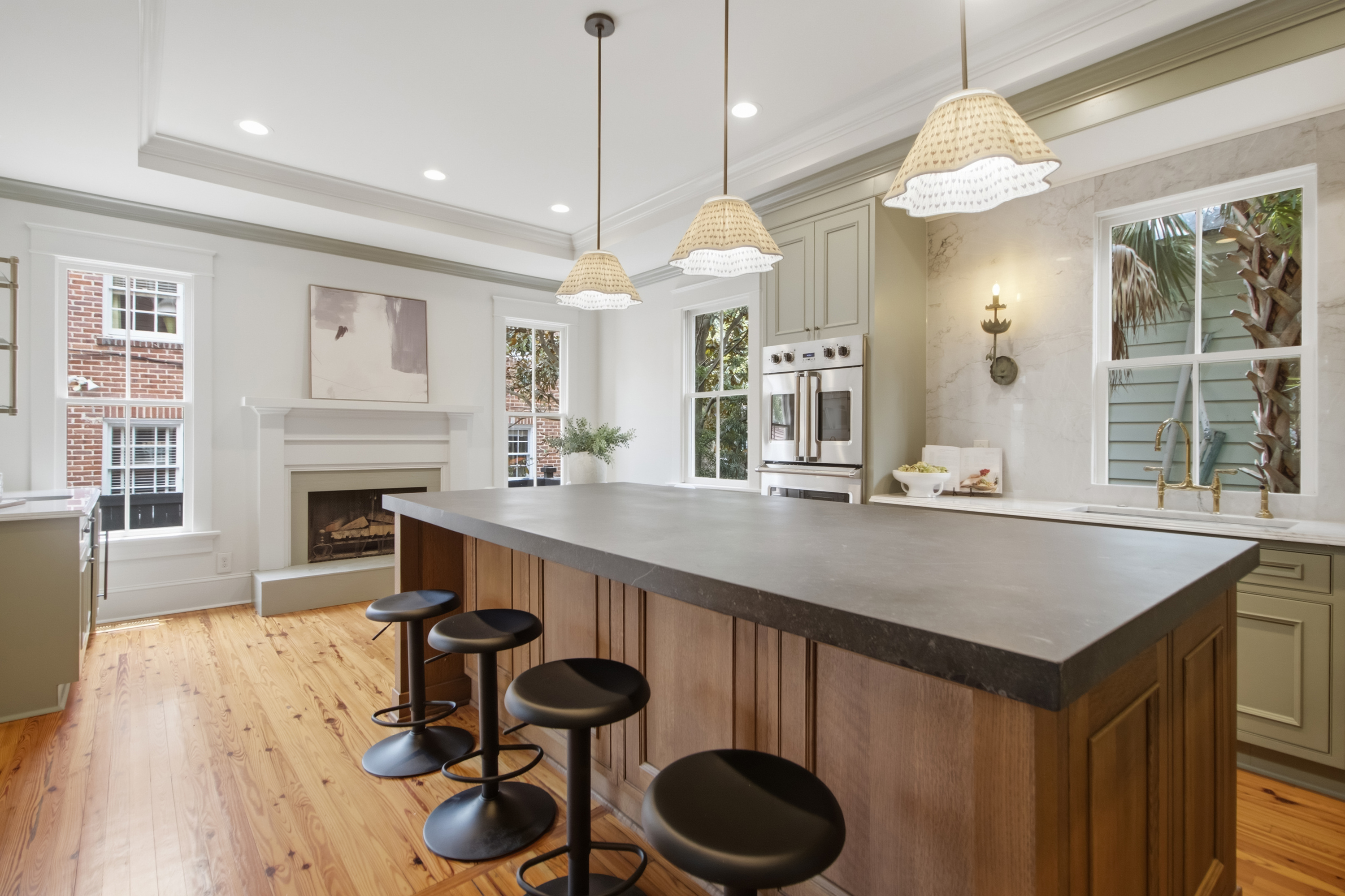 Custom kitchen with broad marble work surfaces