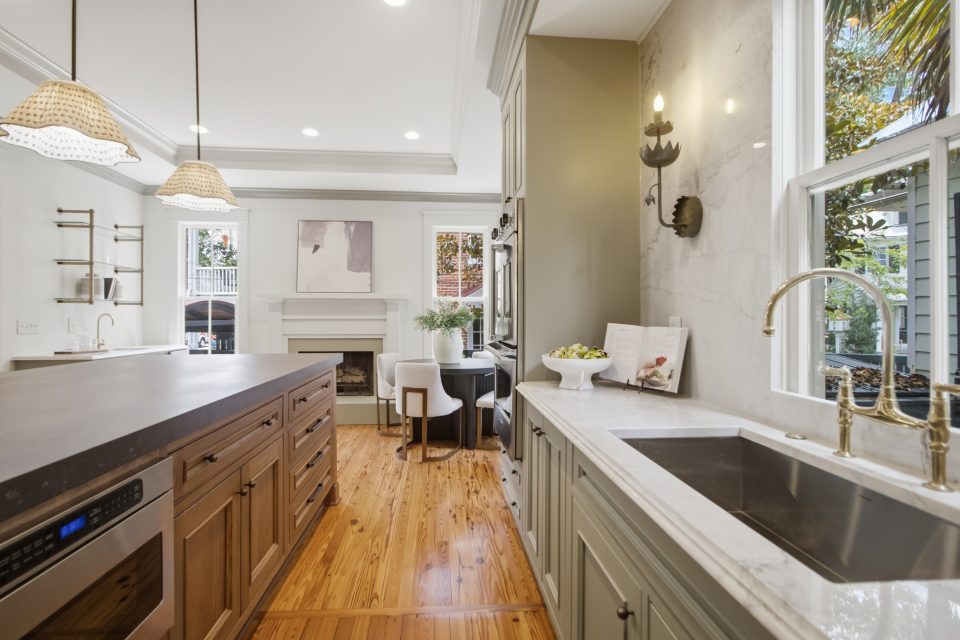 Foyer, staircase, and original millwork at 173 Tradd Street